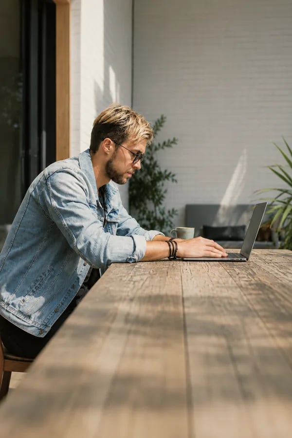 A man exploring car financing on a laptop